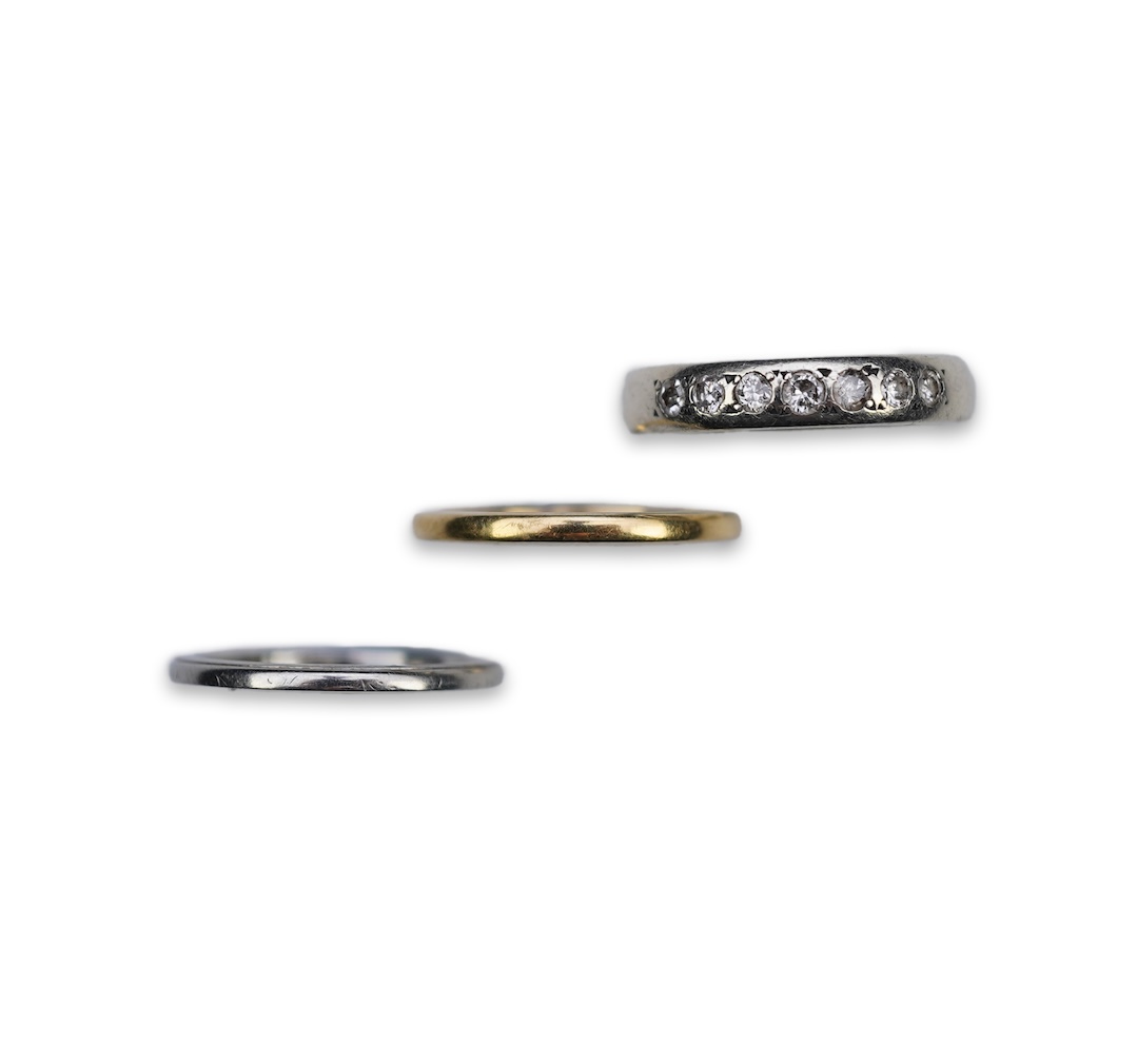 A diamond ring and two gold wedding rings